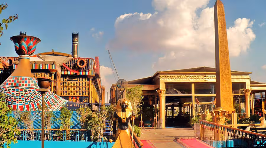 Nile Pharaohs cruise dock with pharaonic decor, obelisk and sphinx statue, Cairo Nile dinner cruise