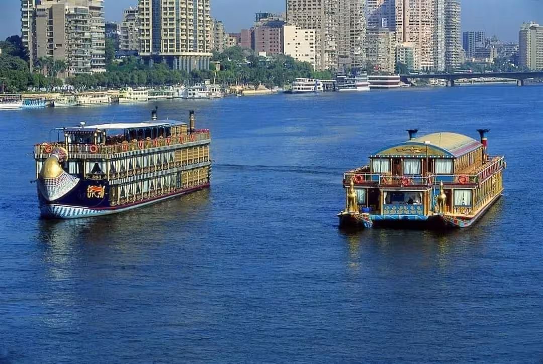 Two luxury Nile cruise boats on the Cairo Nile River, scenic Nile Pharaohs Cruising booking tour view