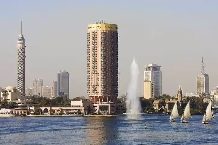 Nile River Cairo skyline with felucca boats, scenic stop on Cairo and Giza Pyramids bus tour from Sharm El Sheikh