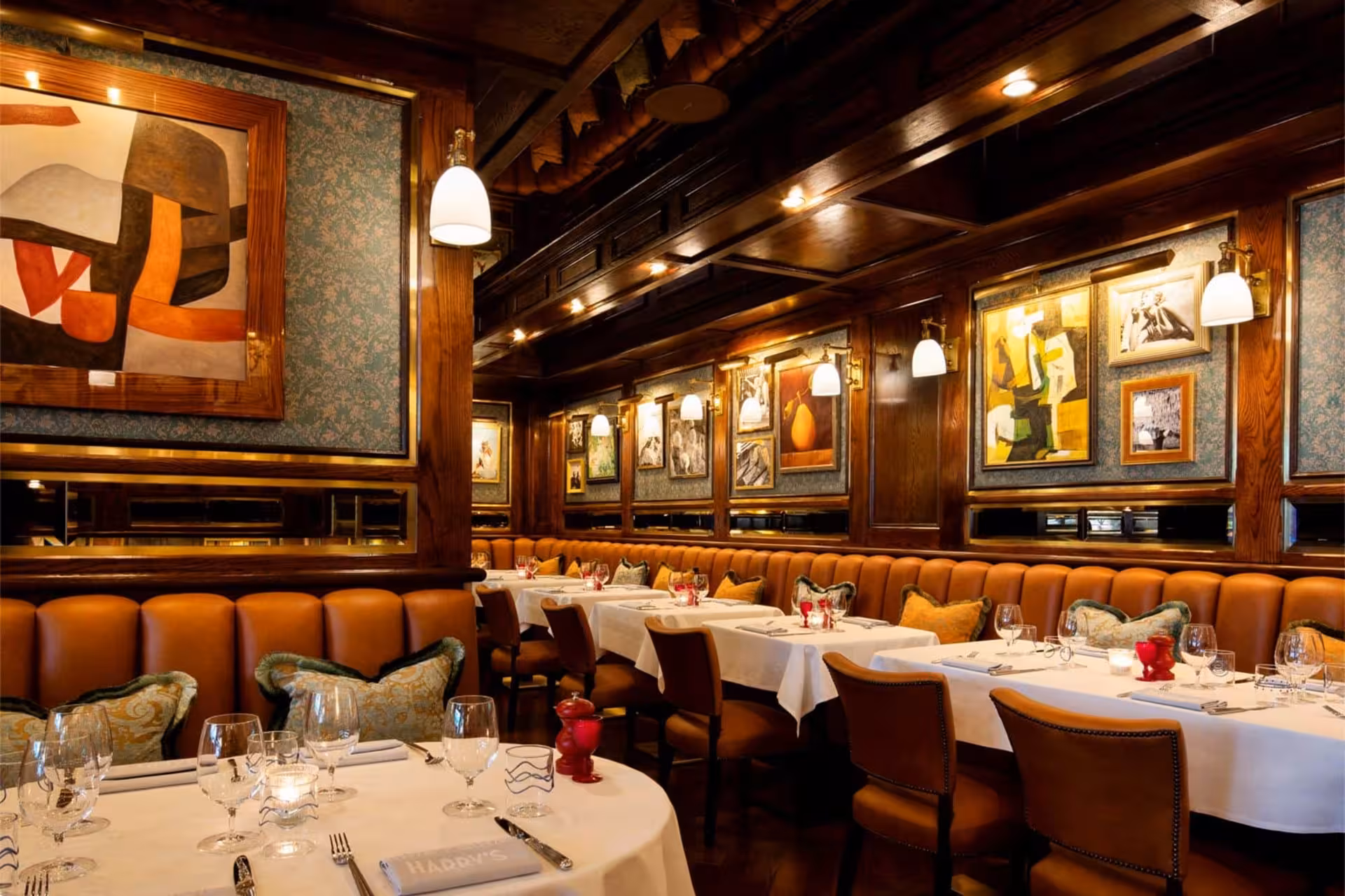 Elegant dining room with candlelit tables and plush seating, perfect for a romantic Nile River dinner cruise in Cairo