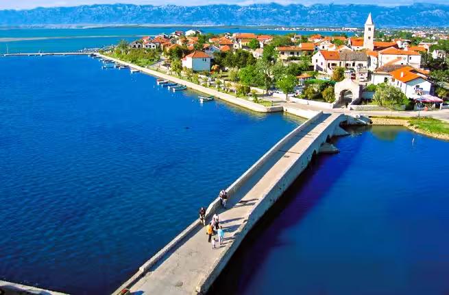 Aerial view of Nin lagoon bridge to old town and church, Croatia tour combo with Zadar history and beach
