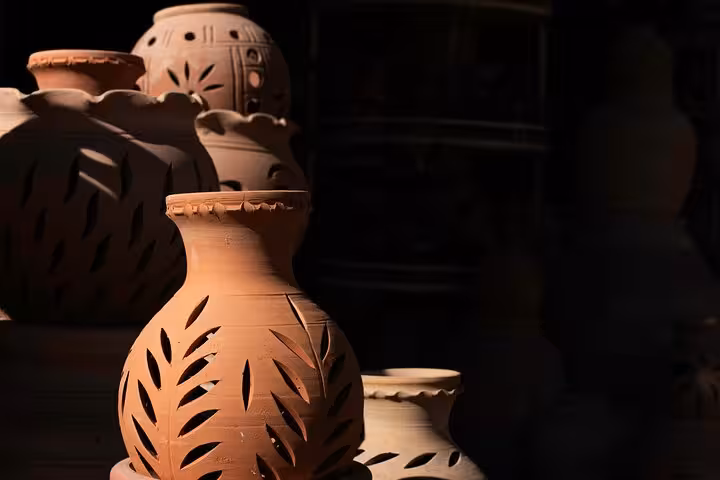 Handcrafted clay lanterns and pottery at Nizwa Souq, showcasing traditional Omani crafts on a full-day cultural tour