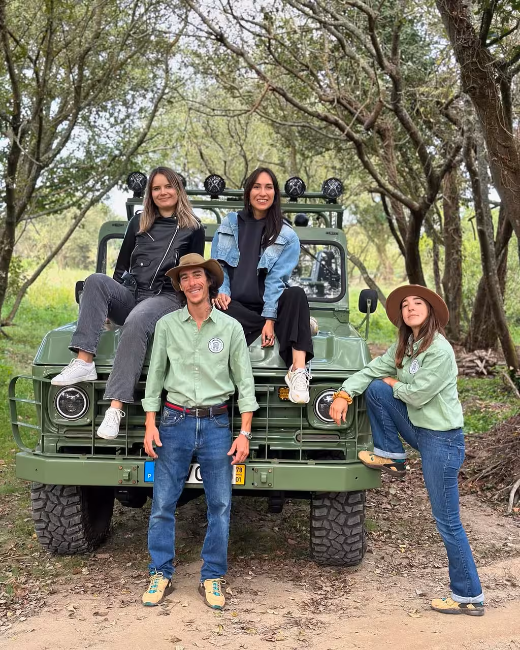 Guides and guests with vintage 4x4 on North Coast birdwatching adventure, classic car nature tour