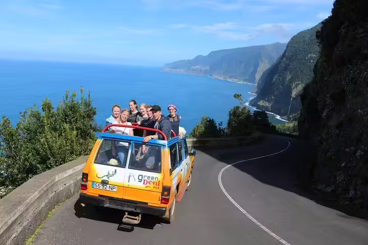 Tourists enjoy a scenic 4x4 ride along the stunning coastal cliffs of Santana and Caniçal on the Northeast local tour.