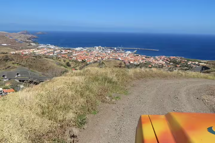 Stunning coastal view of Northeast Madeira from a guided tour, showcasing vibrant landscapes and the expansive Atlantic Ocean.