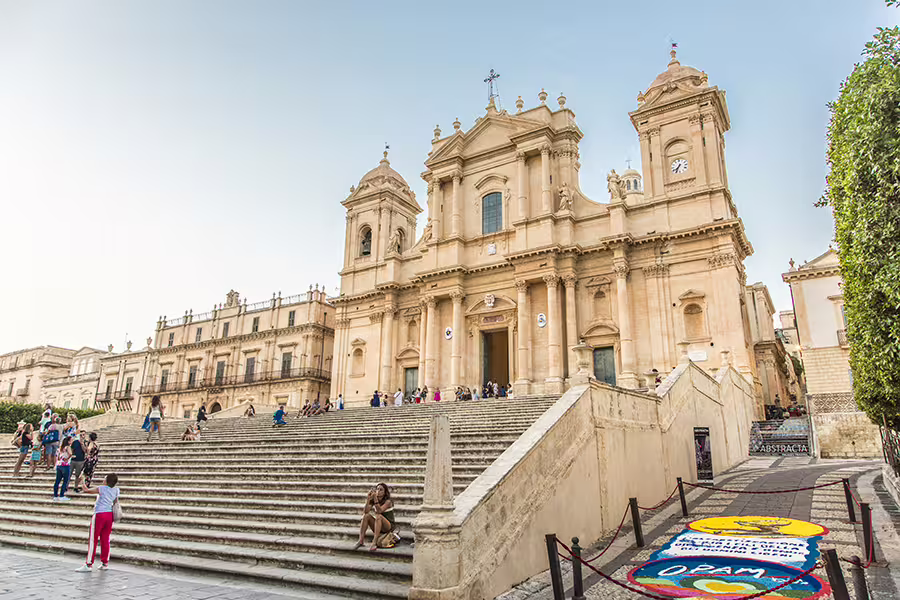 Noto Cathedral steps and Sicilian Baroque facade, must-see stop on Taormina to Syracuse tour via Val di Noto