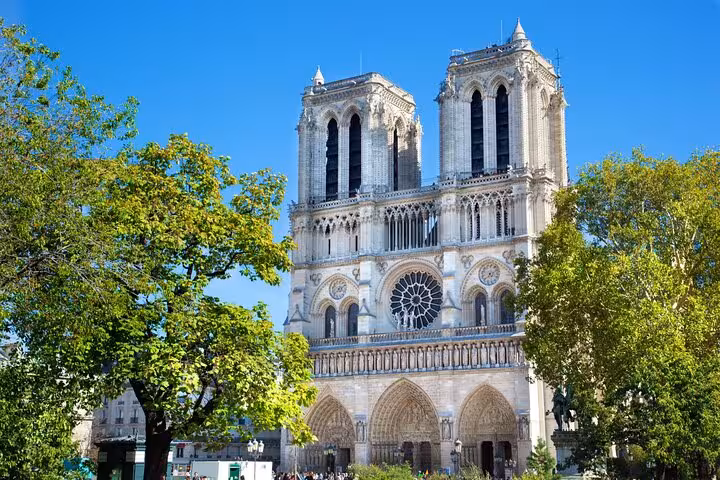 Notre-Dame Cathedral facade in Paris, a highlight on private half-day tour with Seine cruise and Louvre entry