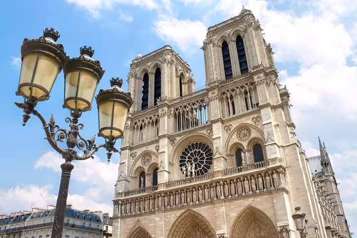 Close-up of Notre-Dame facade on Paris private half-day tour, a classic stop before Seine cruise and Louvre entrance