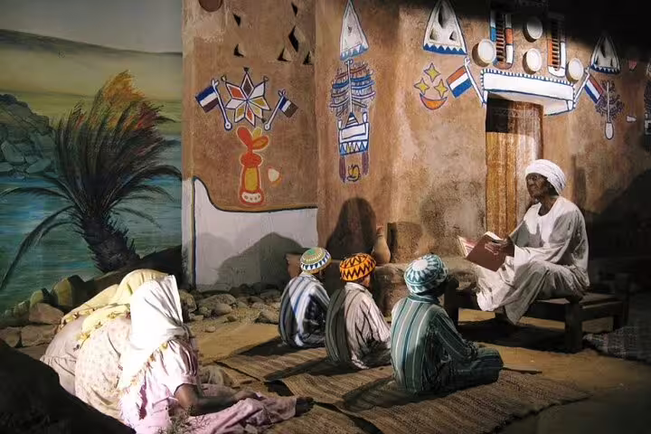 Nubian Museum diorama of Nubian storytelling with painted wall motifs in Aswan on private guided tour