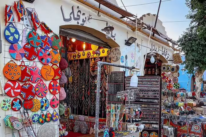 Nubian Village market in Aswan with handmade baskets and souvenirs, visited on private motorboat tour from Aswan