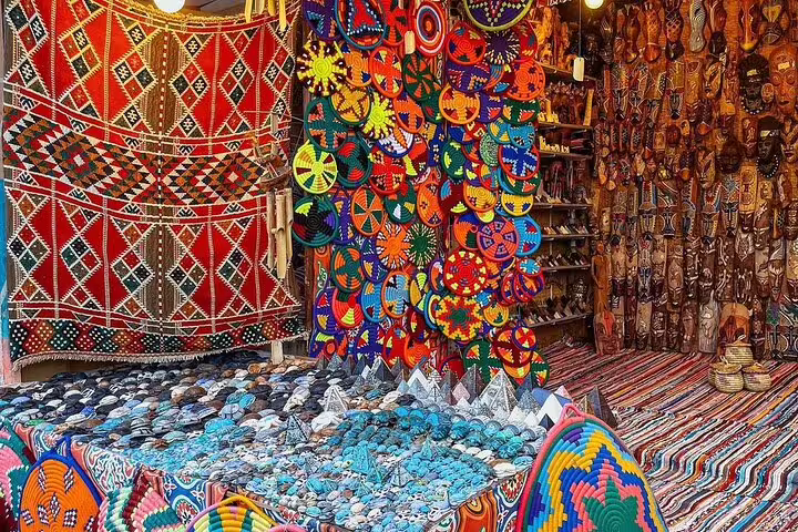 Colorful Nubian Village market crafts and woven baskets on Aswan motorboat private tour with guide