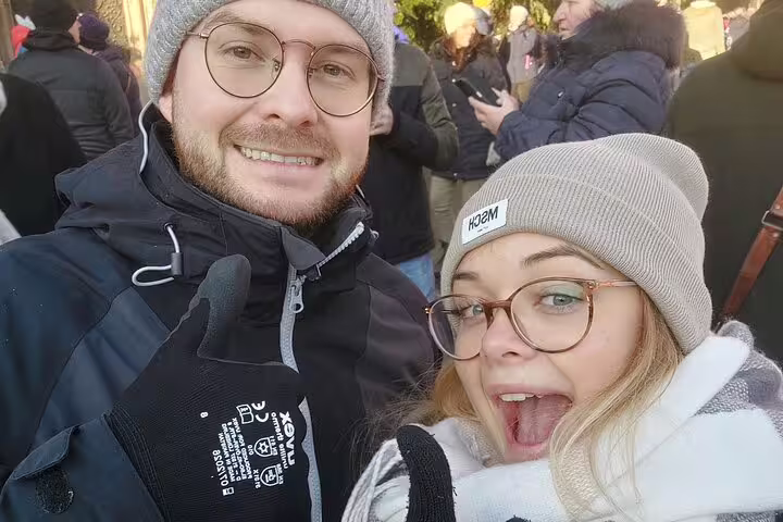 Couple selfie in winter gear on Nuremberg scavenger hunt and sights self-guided walking tour