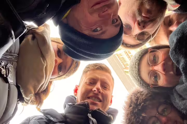 Group selfie looking down during Nuremberg scavenger hunt, fun self-guided city sights walking tour