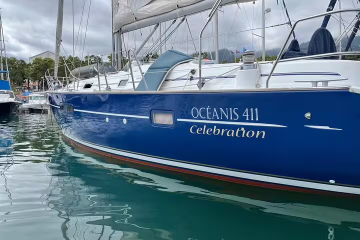 Blue Oceanis 411 sailboat docked at Madeira's south coast marina, offering a relaxing half-day sailing experience.