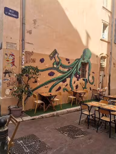 Octopus mural on Rue Saint-Saëns café terrace in Le Panier, Marseille, a highlight of the walking tour