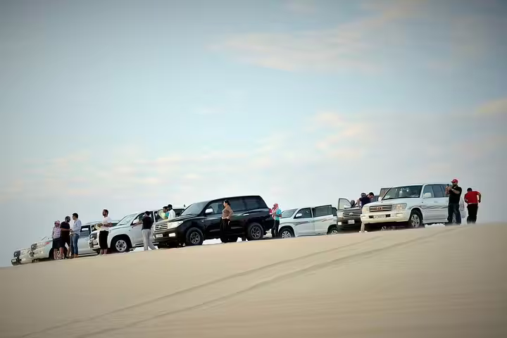 Off-road vehicles ready for an exciting dune bash adventure in the desert.