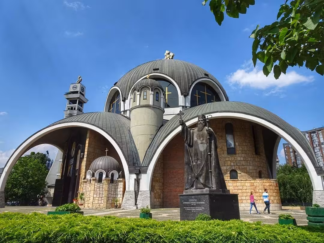 Explore the architectural beauty of Ohrid's unique church domes and statue on a day trip from Pogradec, Macedonia.