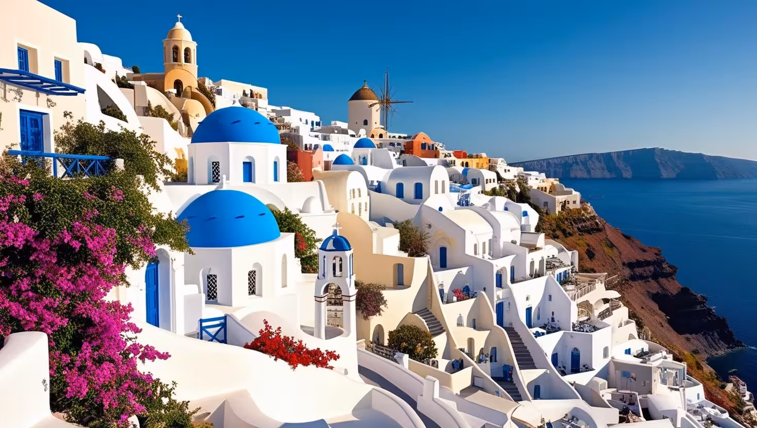 Oia Santorini blue-domed churches and whitewashed cave houses above the caldera on iconic highlight tour