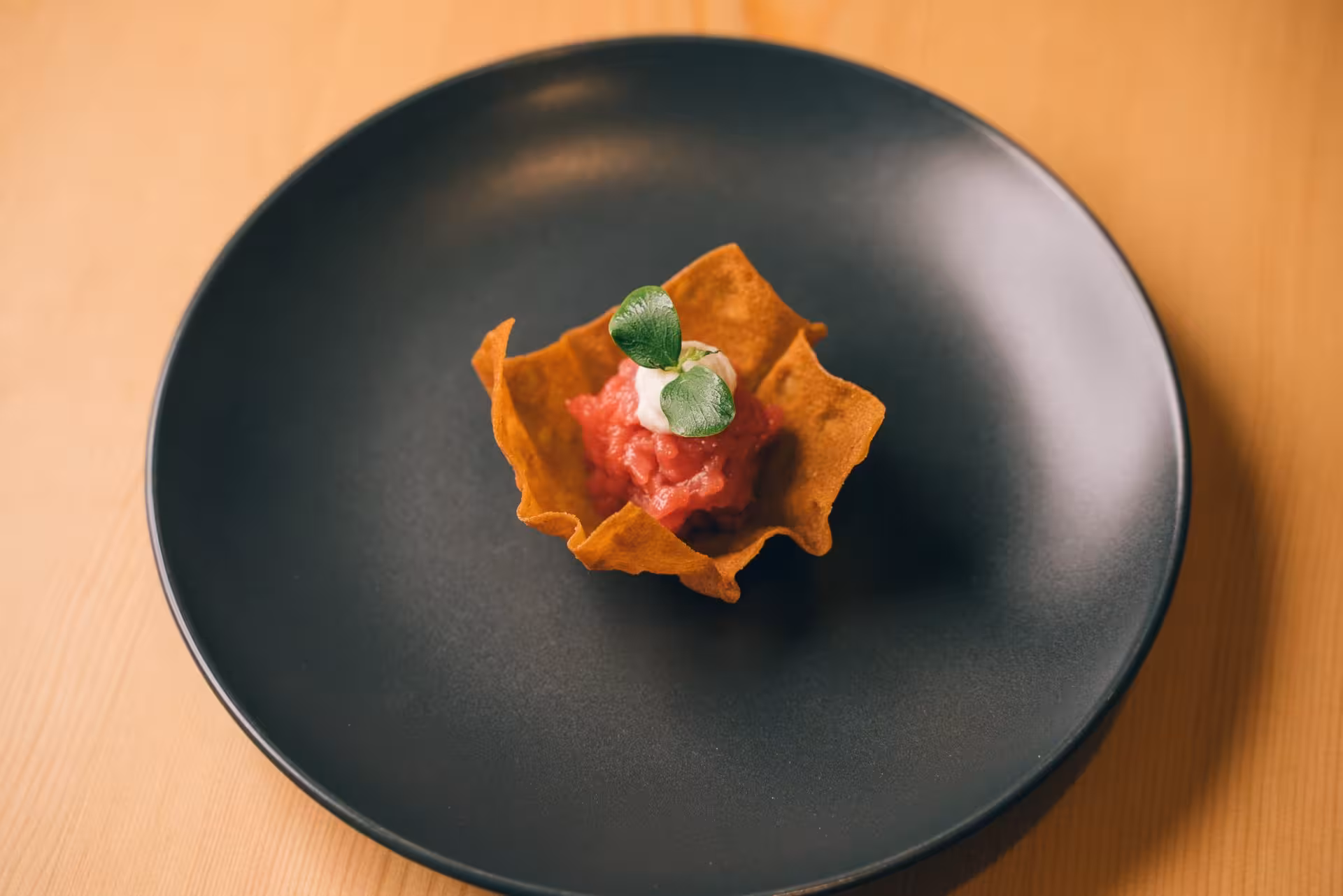 Delicate tartare nestled in a crispy shell, featured in Olbia pasta workshop tasting tour.