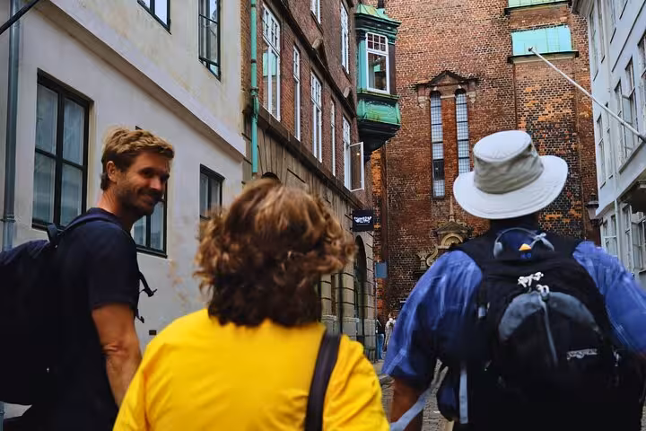 Discover hidden alleys and charming architecture with fellow travelers on a guided walking tour of Old Copenhagen.
