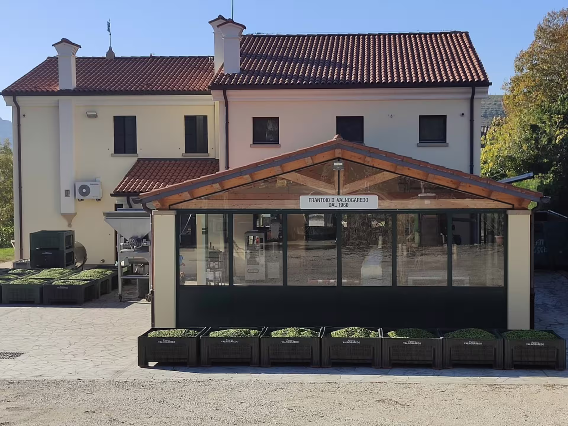 Olive mill in the Padua Hills with harvest crates outside, setting for an extra virgin olive oil tour and tasting