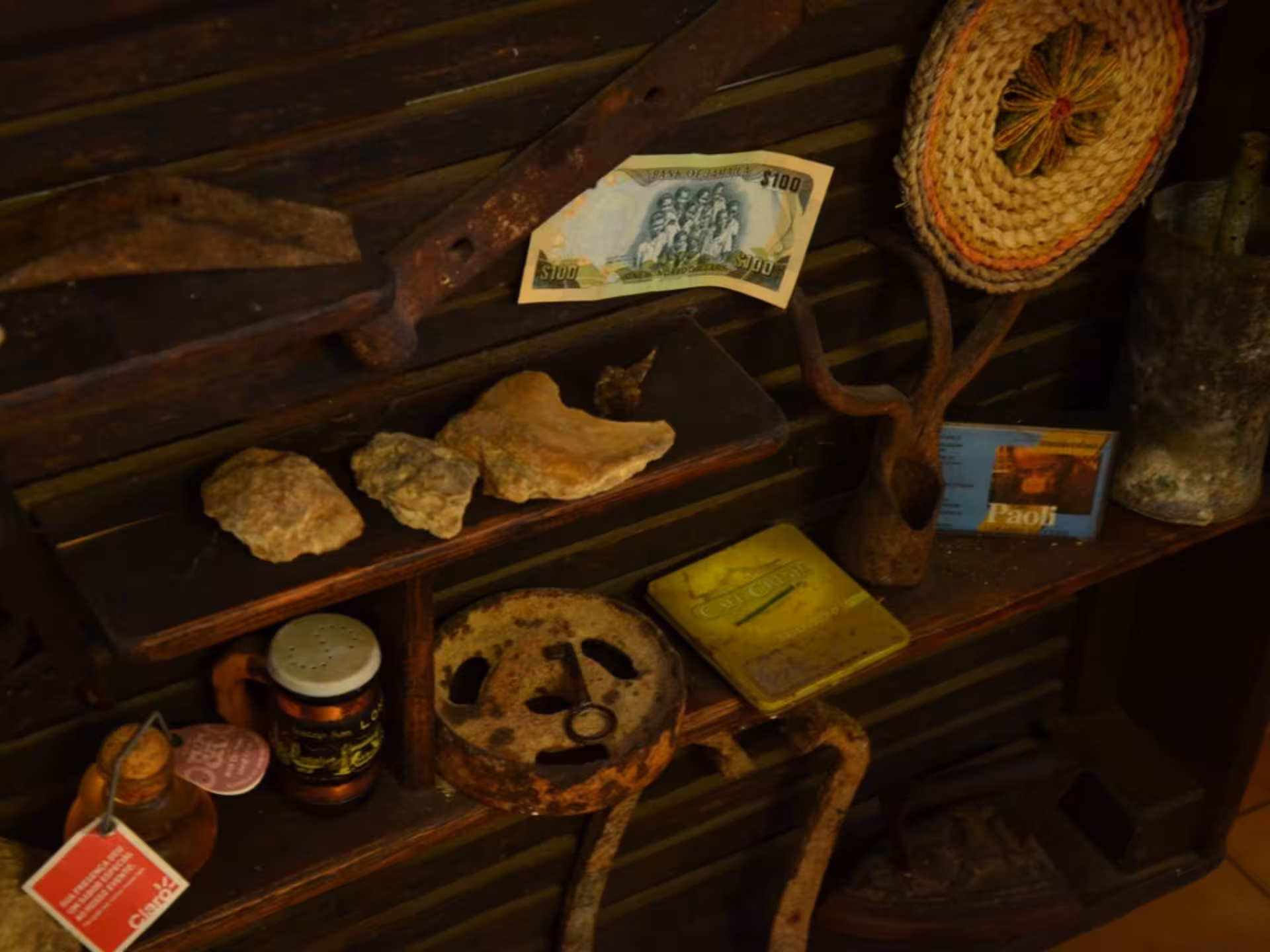 Collection of rustic tools and artifacts in an olive mill, showcasing the traditional heritage of Chianciano's olive oil production.