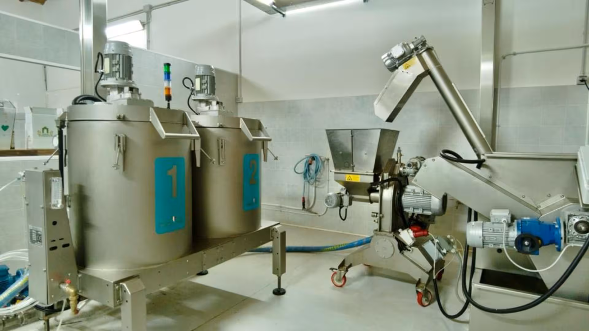 Modern olive oil production machinery in Oristano for guided tasting tours.
