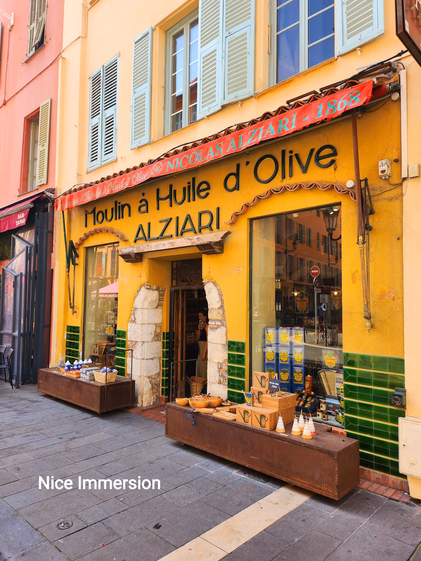 Charming olive oil shop in Nice, featuring rustic decor and locally crafted products, ideal for cultural exploration.