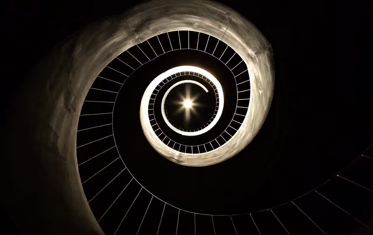 Spiral staircase inside Oltrepò Pavese winery, modern architecture stop on wine tasting and cellar tour