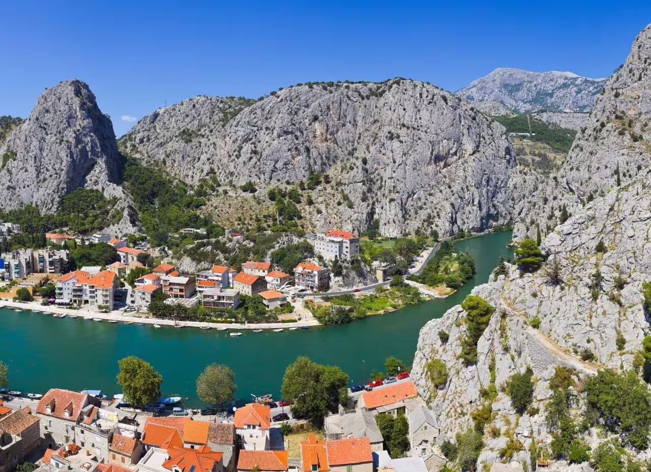 Omiš Cetina River canyon and red-roof town view, scenic stop on Zadar to Split Dalmatian cruise