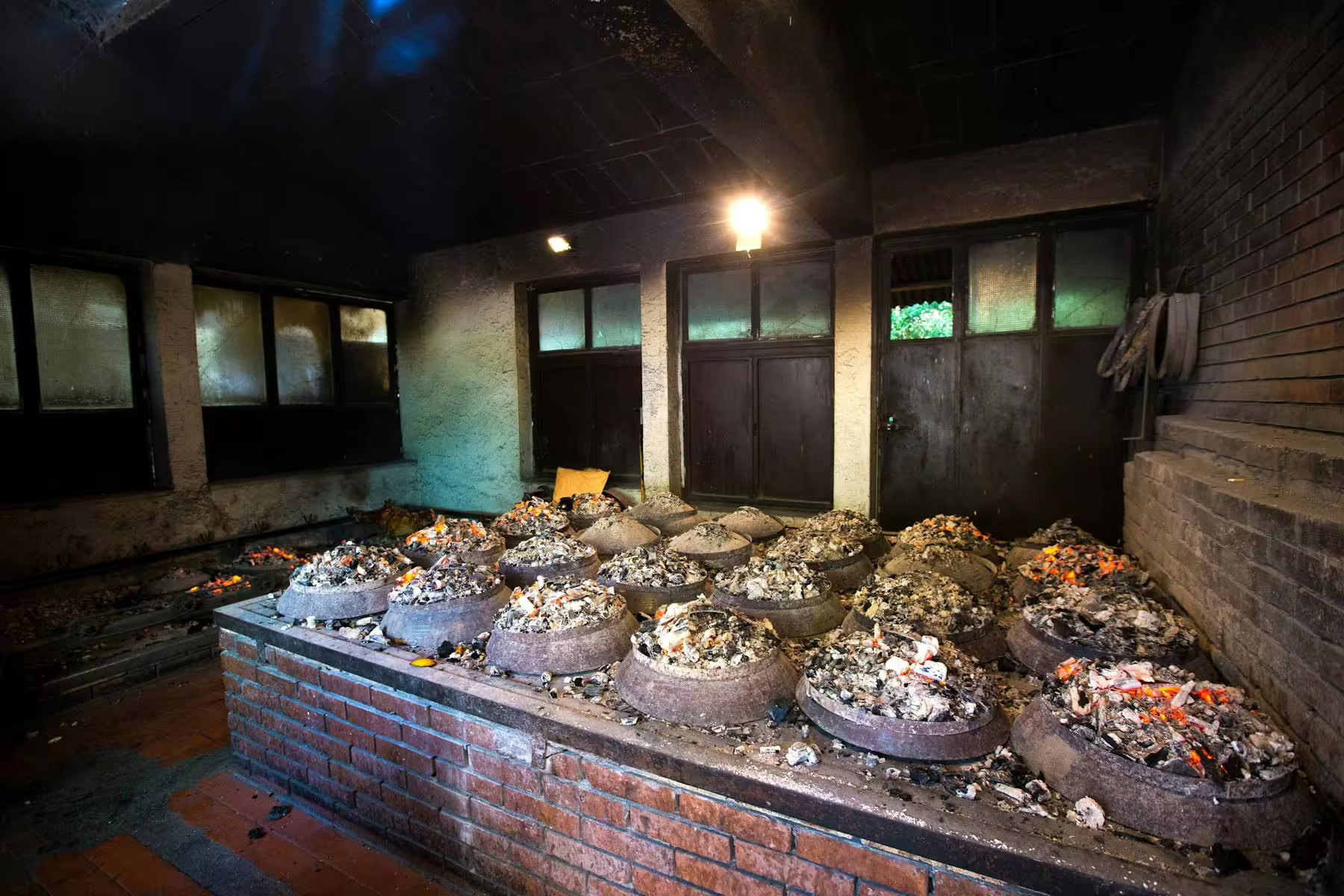 Traditional Dalmatian peka lunch cooking under embers on Omiš and River Cetina boat tour from Makarska