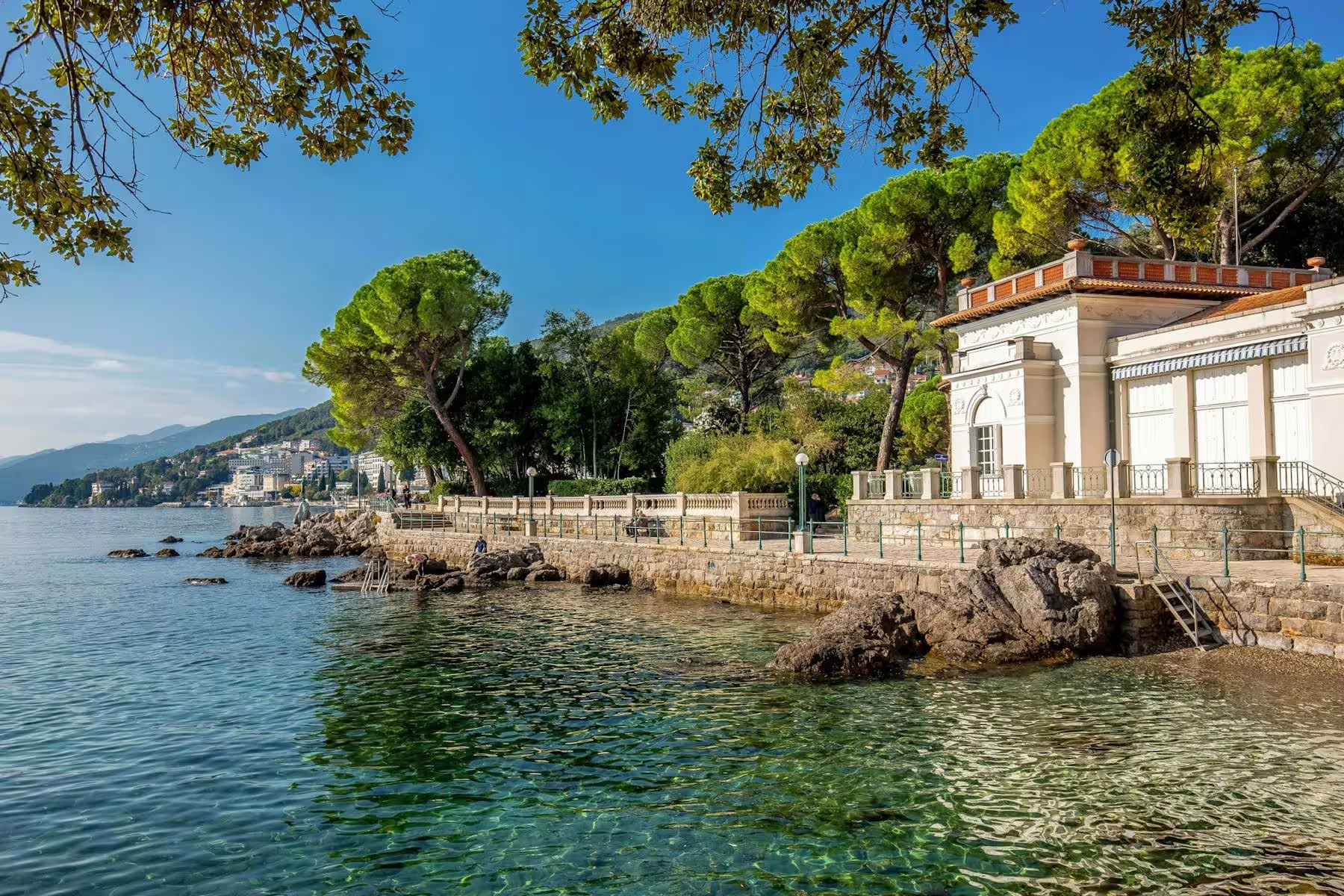 Opatija seaside promenade on Kvarner Bay, Adriatic waterfront villa and pines on a scenic coastal tour