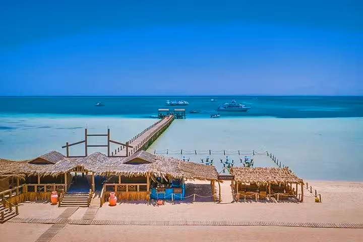 Panoramic Orange Bay Giftun Island huts and long jetty to boats, Hurghada snorkeling tour on the Red Sea