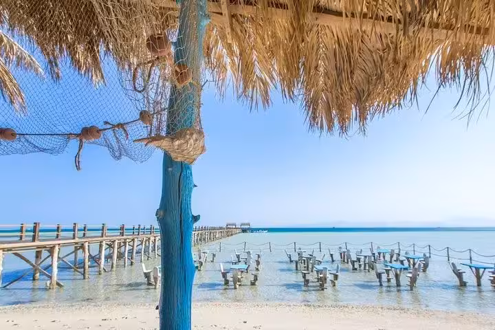 Orange Bay Giftun Island National Park lagoon with overwater swings and pier, Hurghada snorkeling day trip