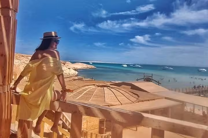 Woman enjoying panoramic Orange Bay beach view on Giftun Island, Hurghada Orange Island sea trip with lunch