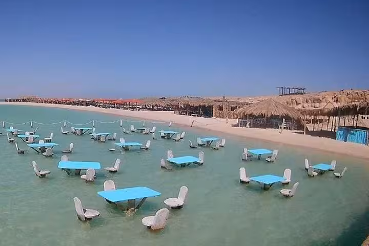 Orange Bay Island shallow lagoon with floating tables and chairs, Hurghada VIP boat trip full-day snorkeling