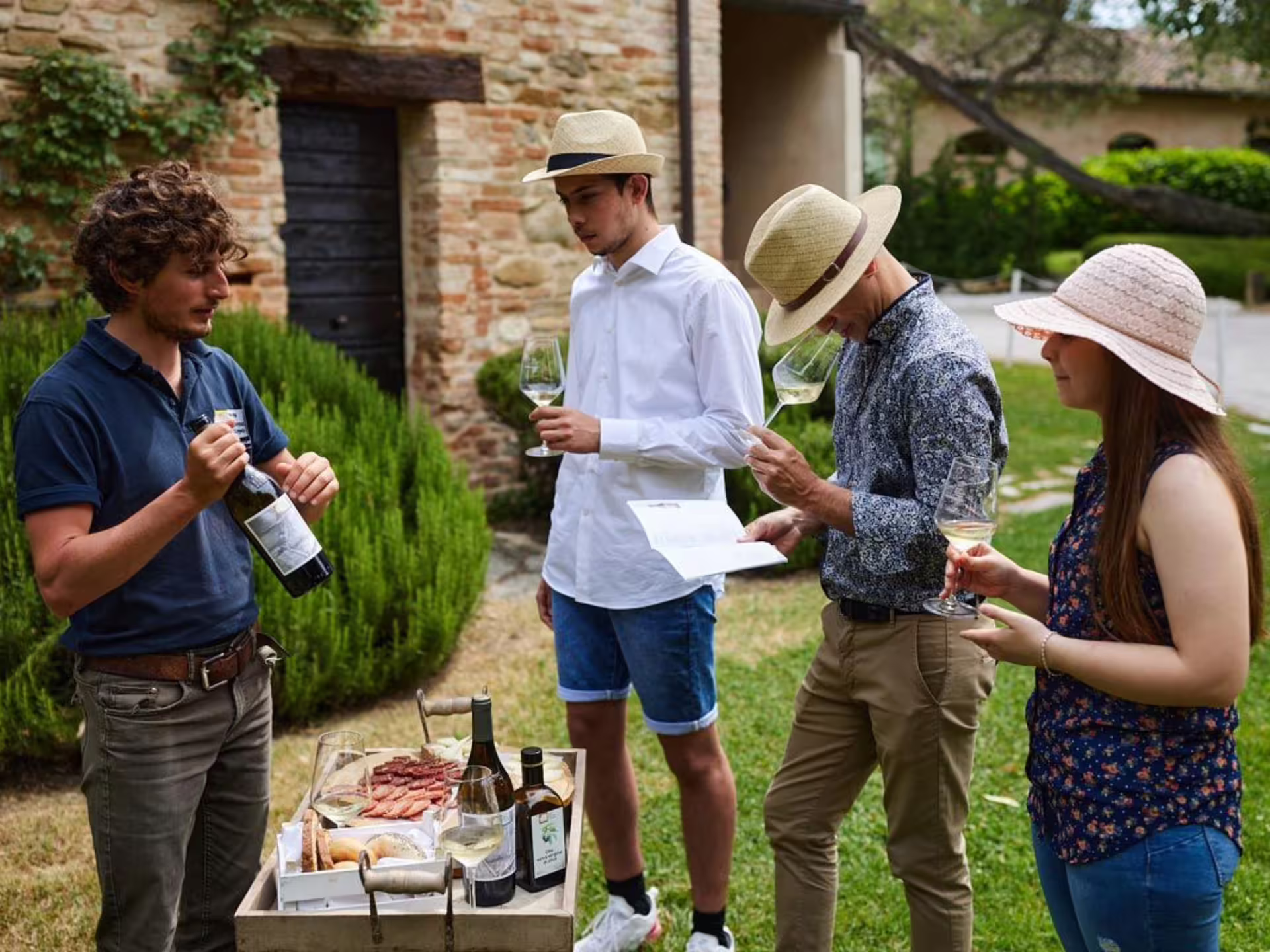 Outdoor boutique winery visit near Urbino with organic wine tasting and local snacks, guided 5-wine flight