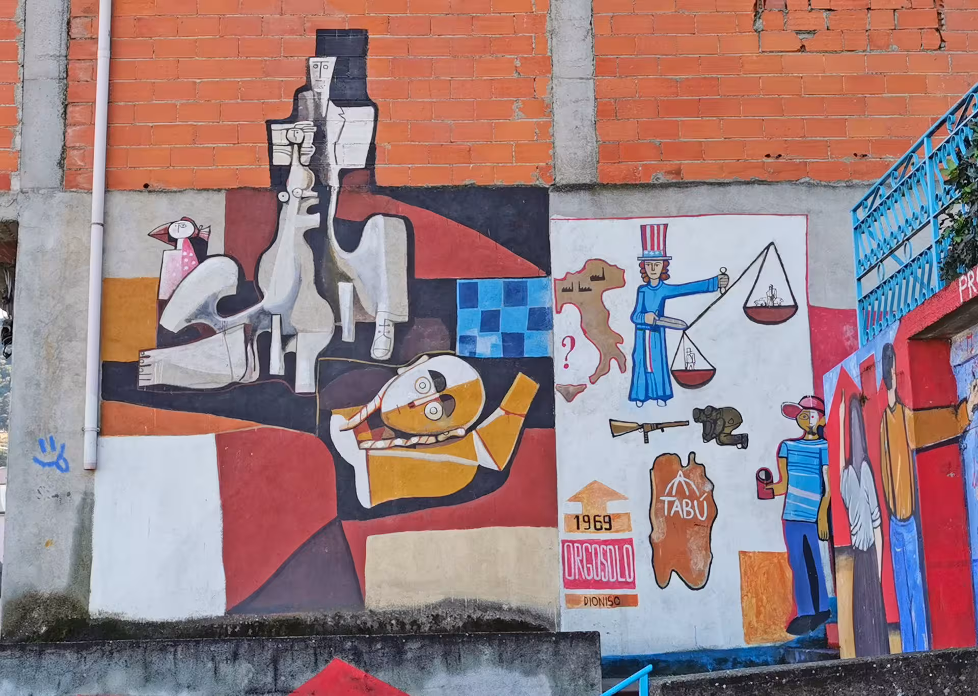 Vivid murals in Orgosolo showcasing cultural and political themes, a highlight of the private Jeep tour from Orosei.