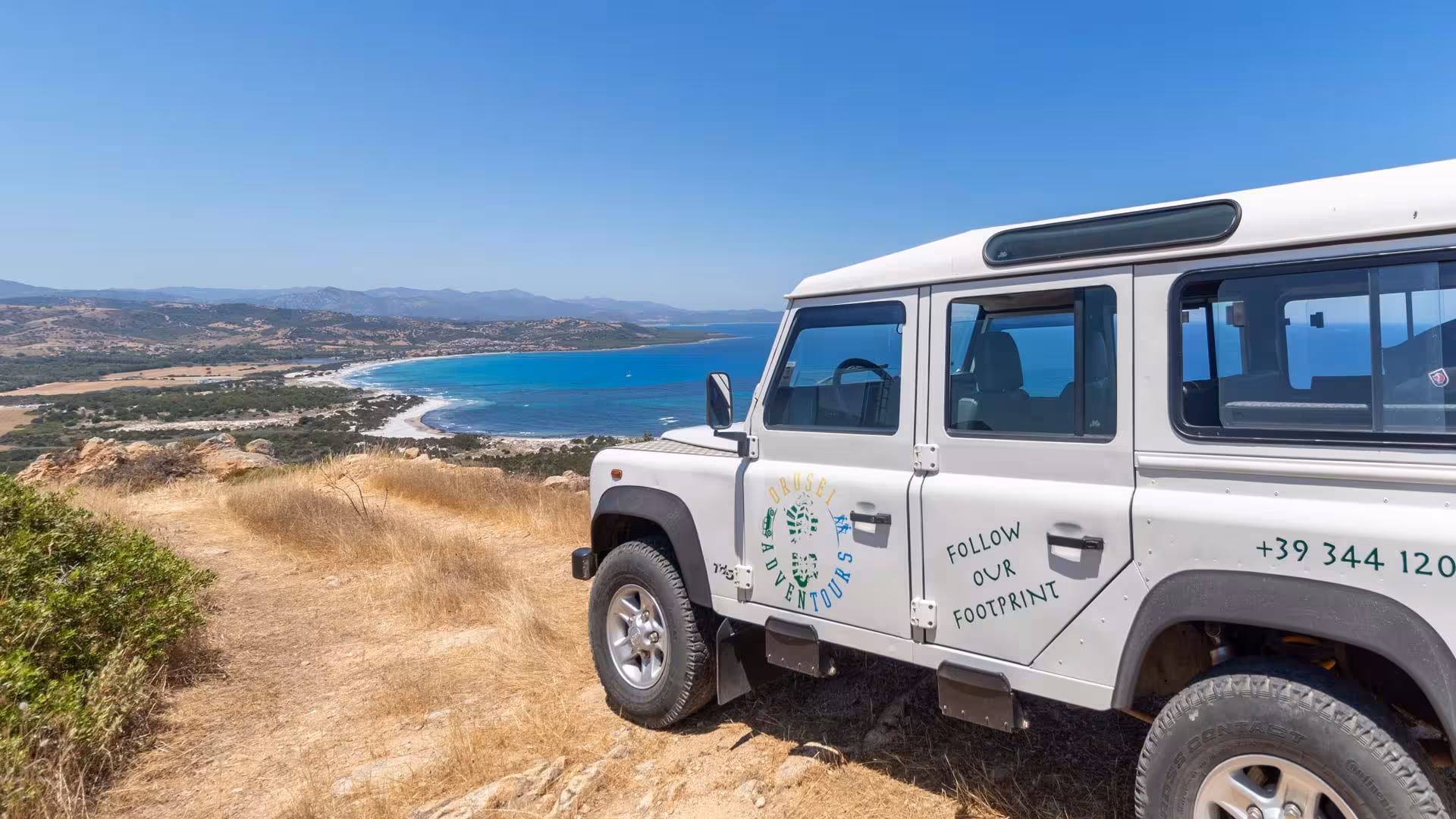 Explore the stunning coastline of Biderosa with a private Jeep tour from Orosei, overlooking crystal blue waters.