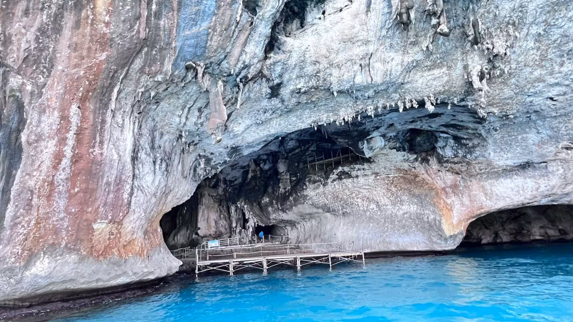 Explore stunning sea caves with crystal-clear waters on a dinghy tour from Orosei to Cala Goloritzè.