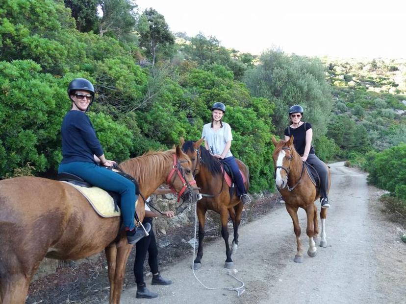 Riders enjoying a scenic horseback tour in the lush Irgoli area of Orosei, perfect for adventure and nature lovers.