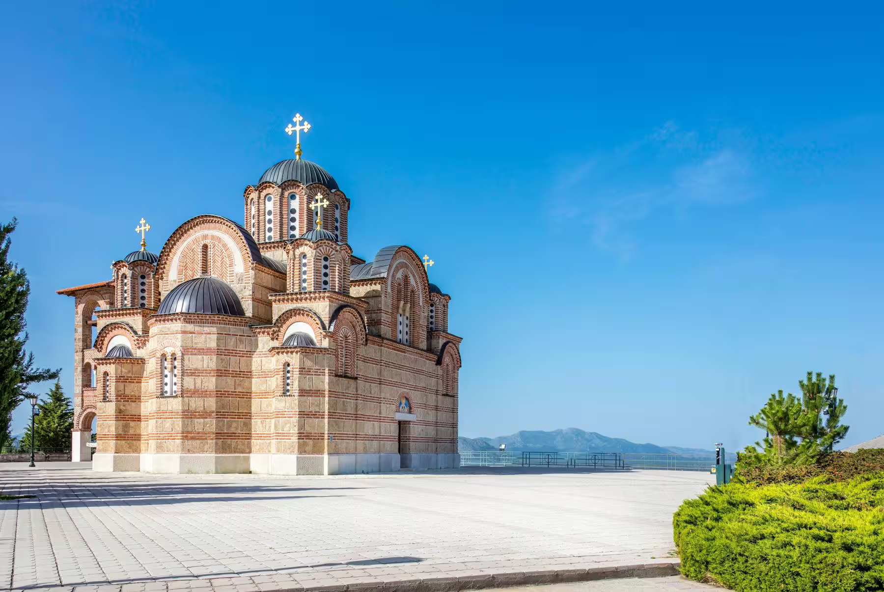 Orthodox church in Trebinje stop on Mostar sightseeing day trip from Makarska Riviera, under blue sky