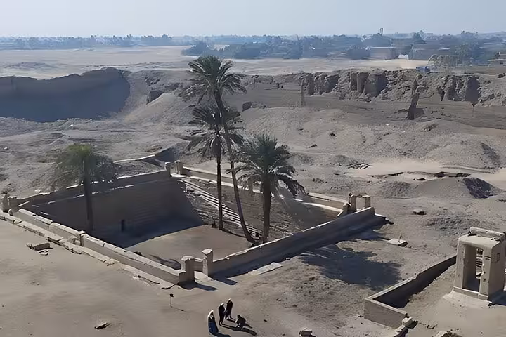 Osireion at Abydos with palm trees and sunken sacred basin, day tour from Hurghada to Dendera