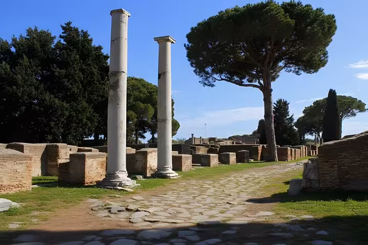 Explore ancient Roman ruins and towering columns at Ostia Antica on a captivating half-day private tour.