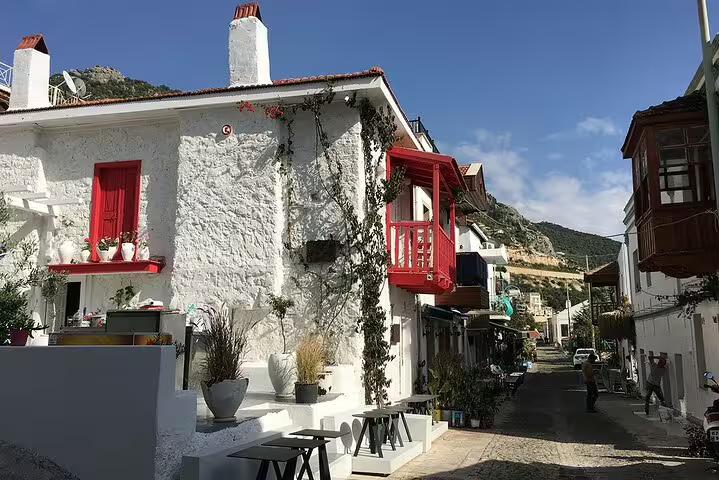 Whitewashed Ottoman-style house with red shutters in Şirince village, stop on 13-day Turkey private guided tour