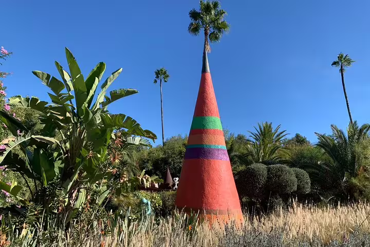 Colorful cone sculpture in Marrakech Majorelle Garden, a vibrant stop on the Ourika Valley day tour
