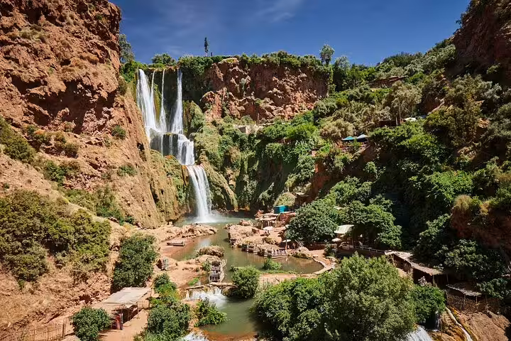 Panoramic Ouzoud Waterfalls cascades and lush valley, highlight of a Marrakech day trip to Ouzoud Falls