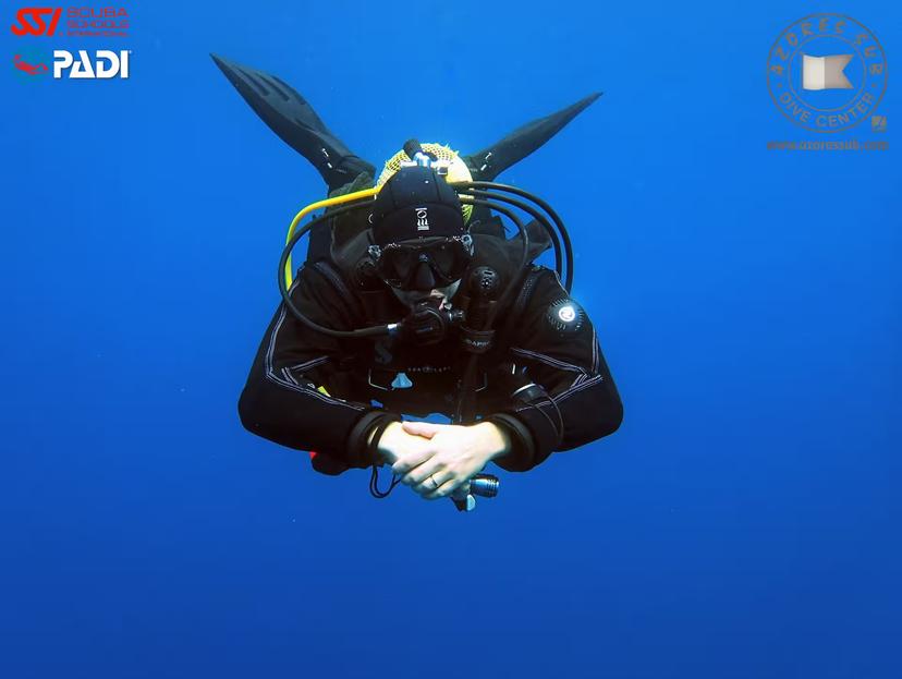 PADI scuba diver hovering in blue water on Deep Diver in São Miguel, Azores, for advanced ocean diving