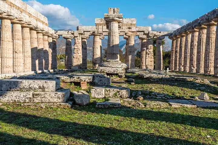 Central sanctuary and fallen stones of Paestum’s ancient Greek temple complex viewed on a private archaeological ruins tour