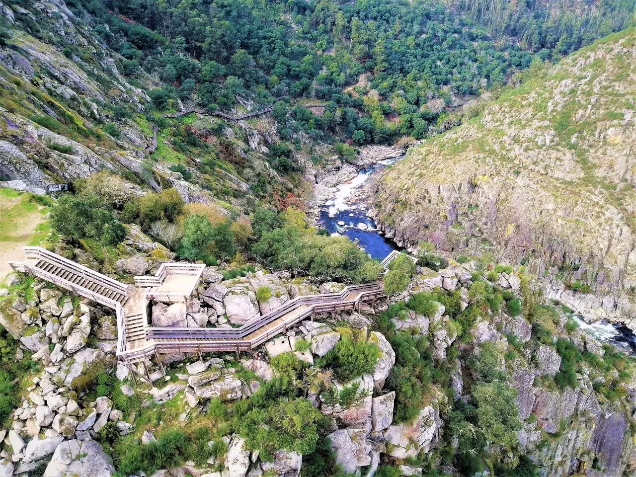 Scenic Paiva Walkways boardwalk above Paiva River gorge in Arouca, Portugal, guided day trip from Porto